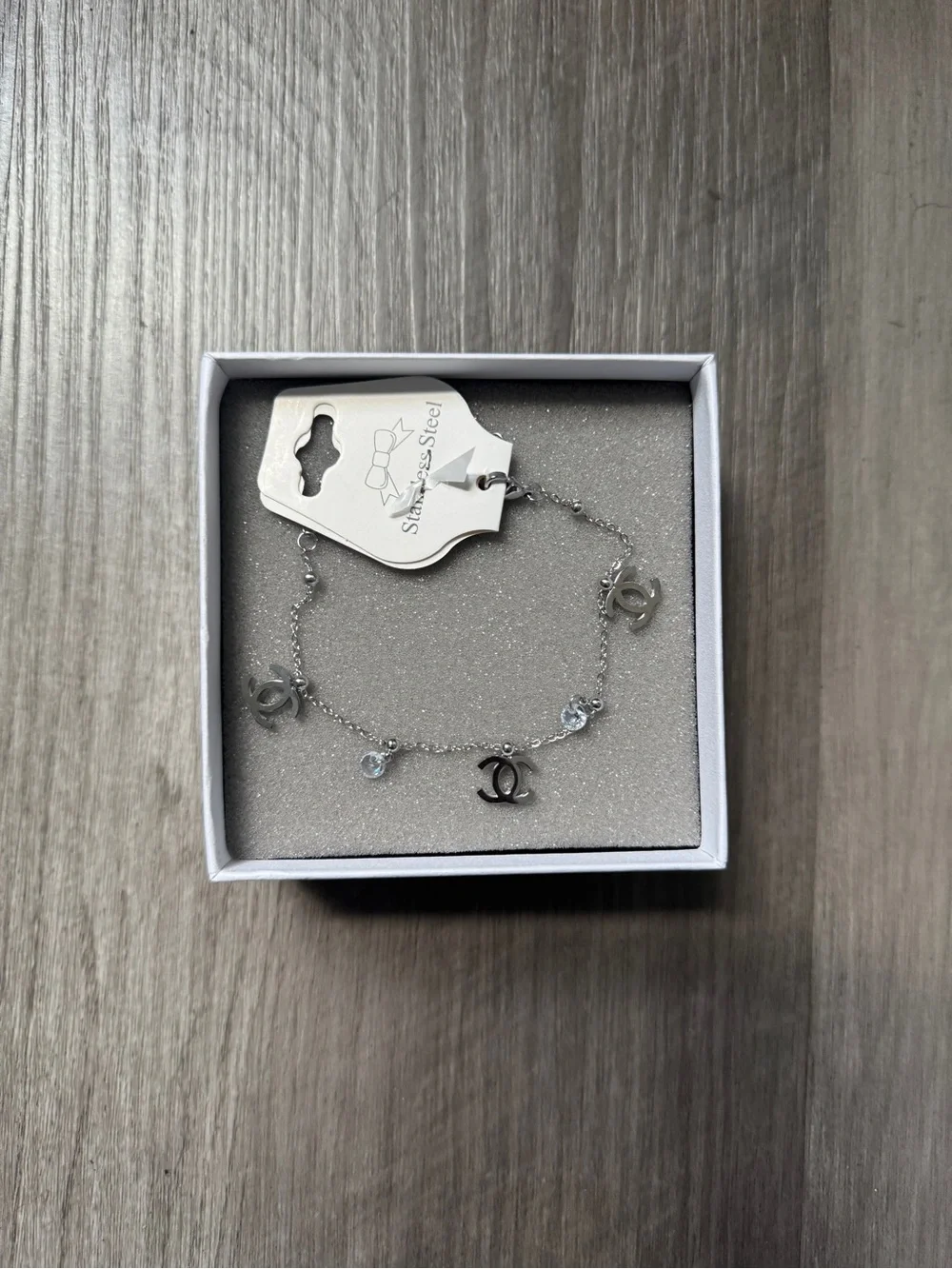 CHNL Silver Charm Bracelet with Interlocking Logo and Crystals